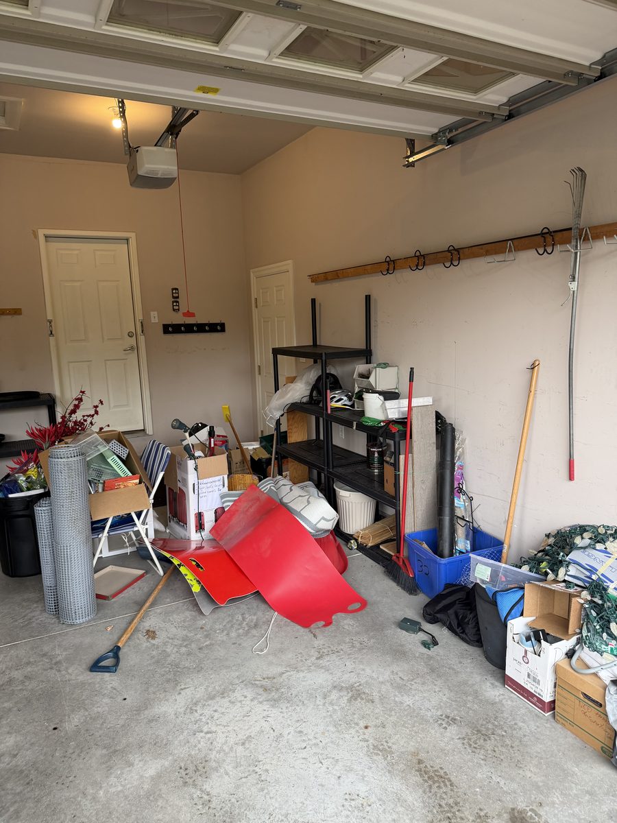Cluttered garage before junk removal