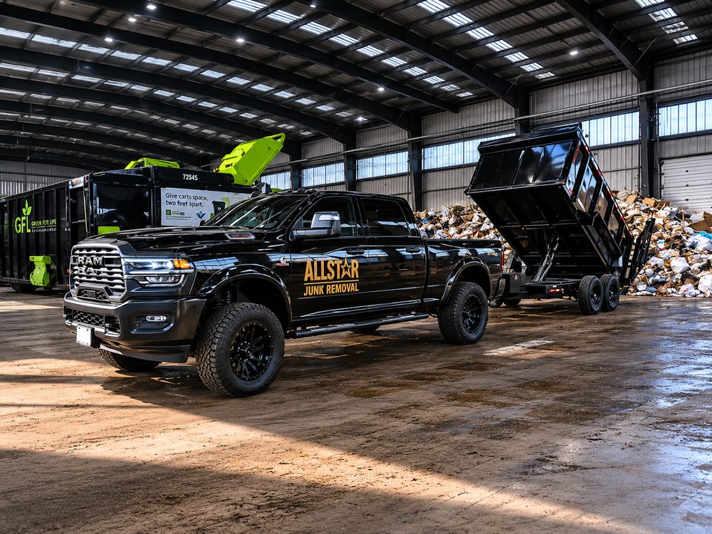 All-Star Junk Removal truck and trailer loaded with junk at the recycling facility