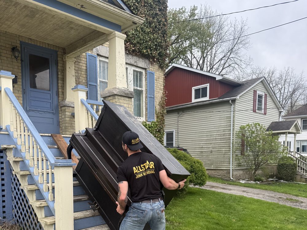 All-Star Junk Removal truck and trailer loaded with furniture and appliances